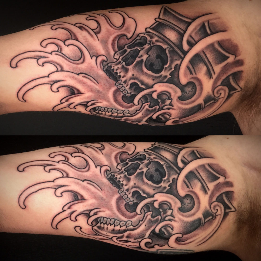Skull and Waves Tattoo